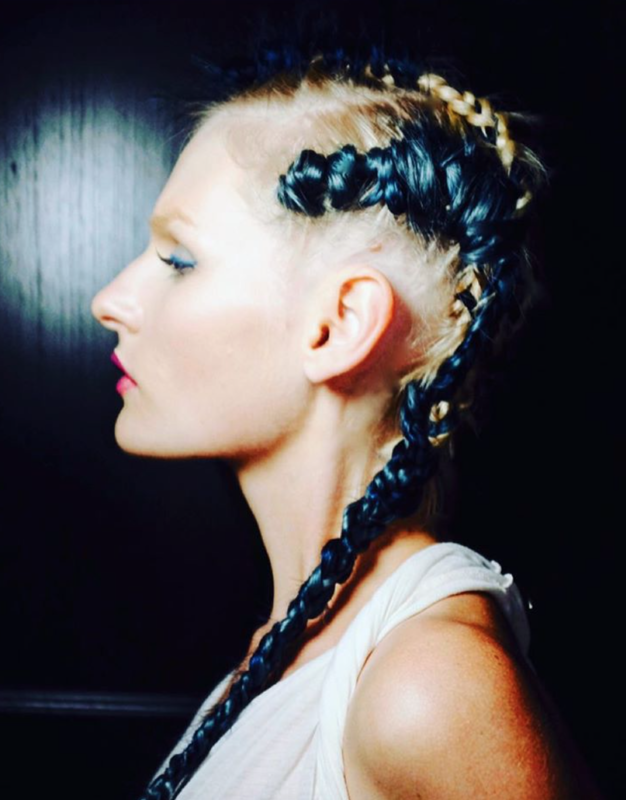 Photo of a side shot of girl with braids