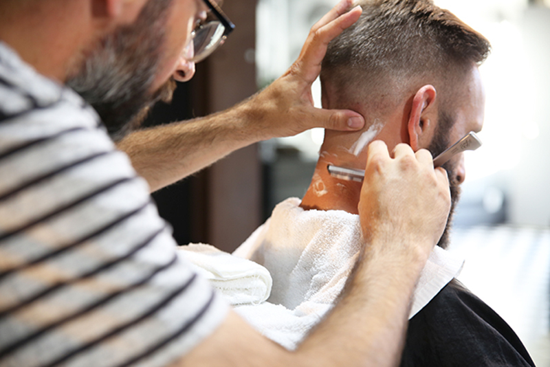 Photo of a man with getting a haircut