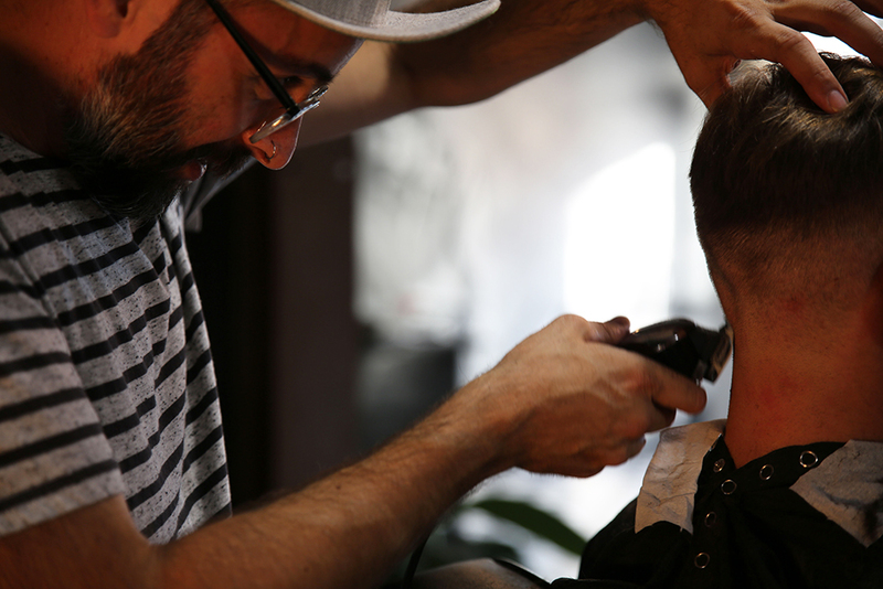 Photo of a man with getting a haircut