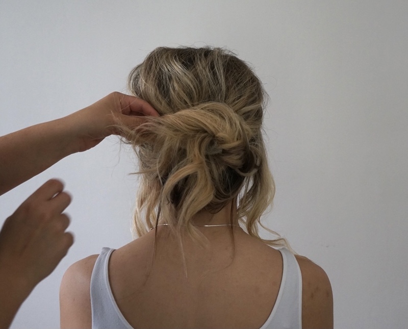 A person with her hair pulled back