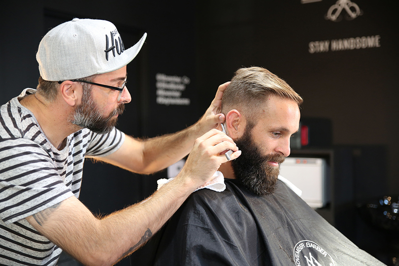 Photo of a man with getting a haircut