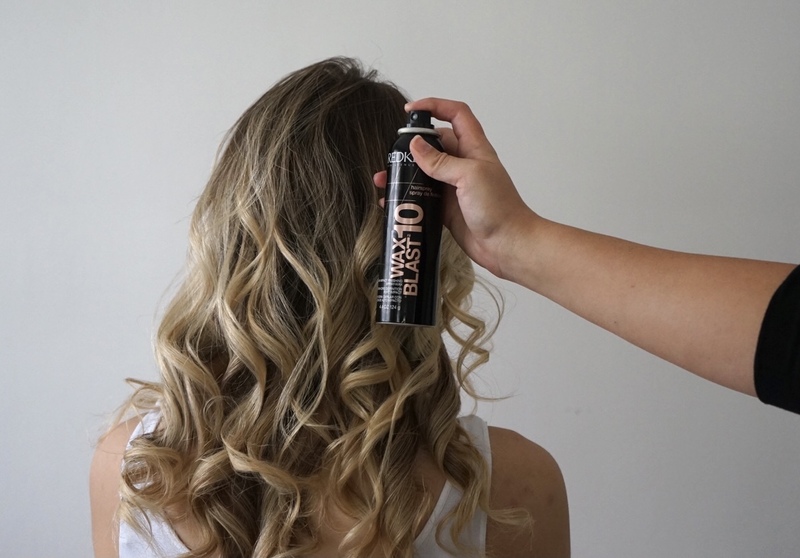 A picture containing hair and Redken Wax Blast