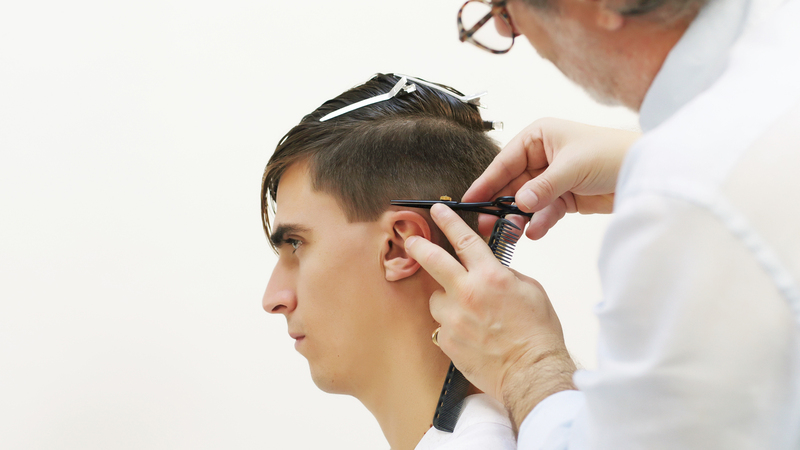 Photo of a man getting his hair cut