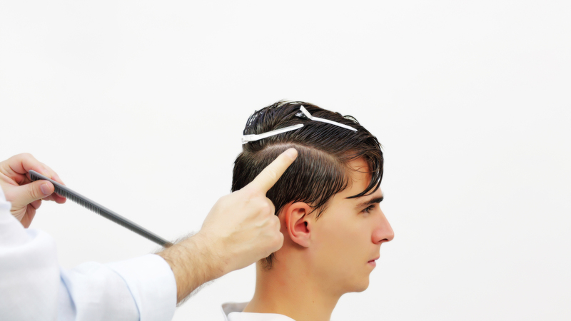 Photo of a man getting his hair cut