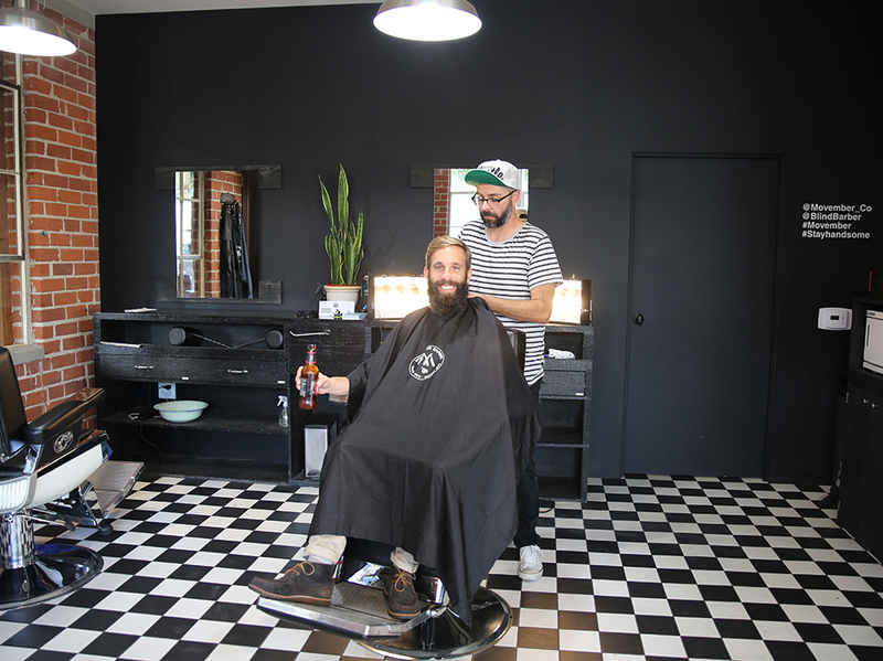 Photo of a man with a beard about to get a haircut