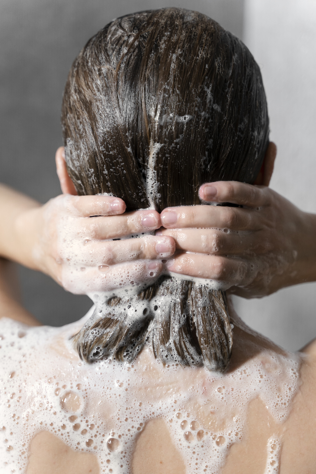 Re sized bf096977fb3d9ef80701 young woman applying anti dandruff product